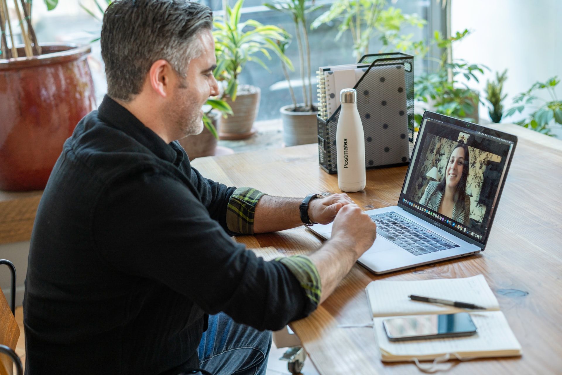 man on video call with woman